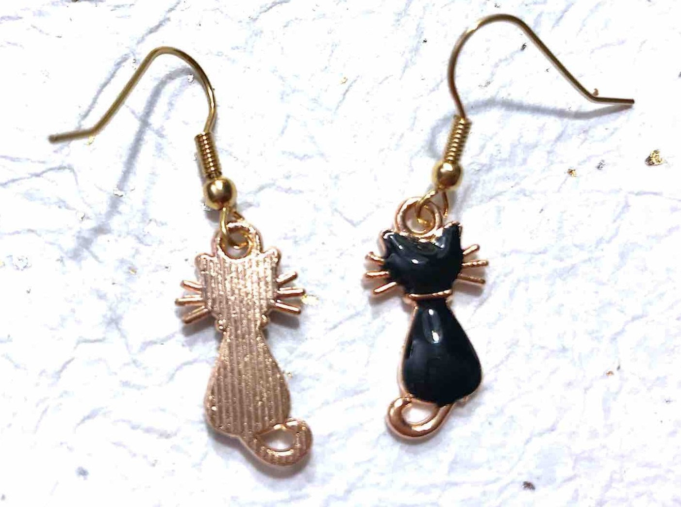 Short earrings with small shiny enamelled black cats, gold-toned stainless steel hooks