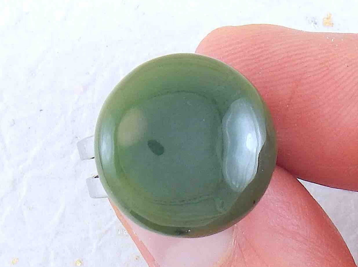 Finger ring with round dark green nephrite jade stone cabochon, stainless steel adjustable base