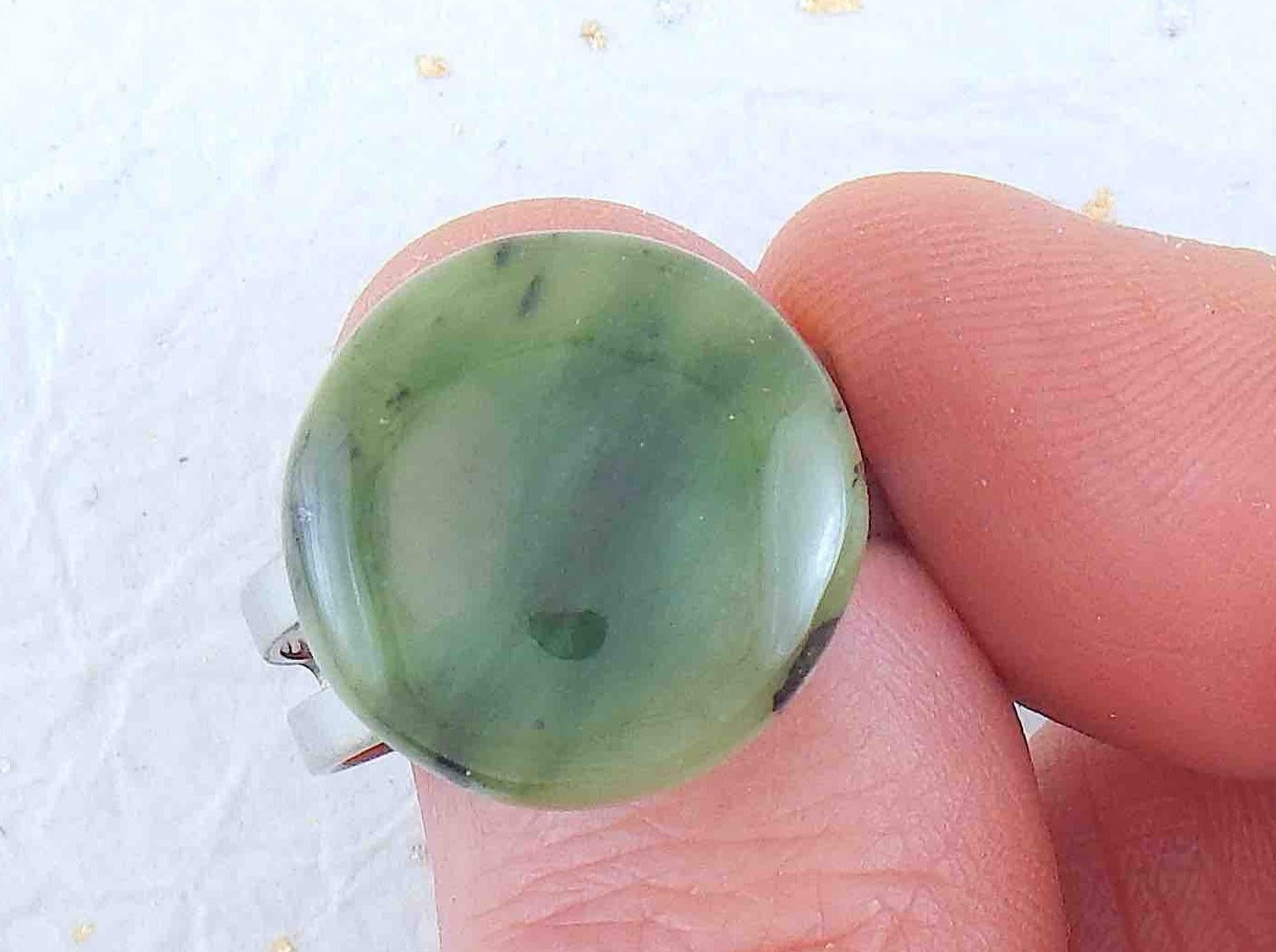 Finger ring with round dark green nephrite jade stone cabochon, stainless steel adjustable base