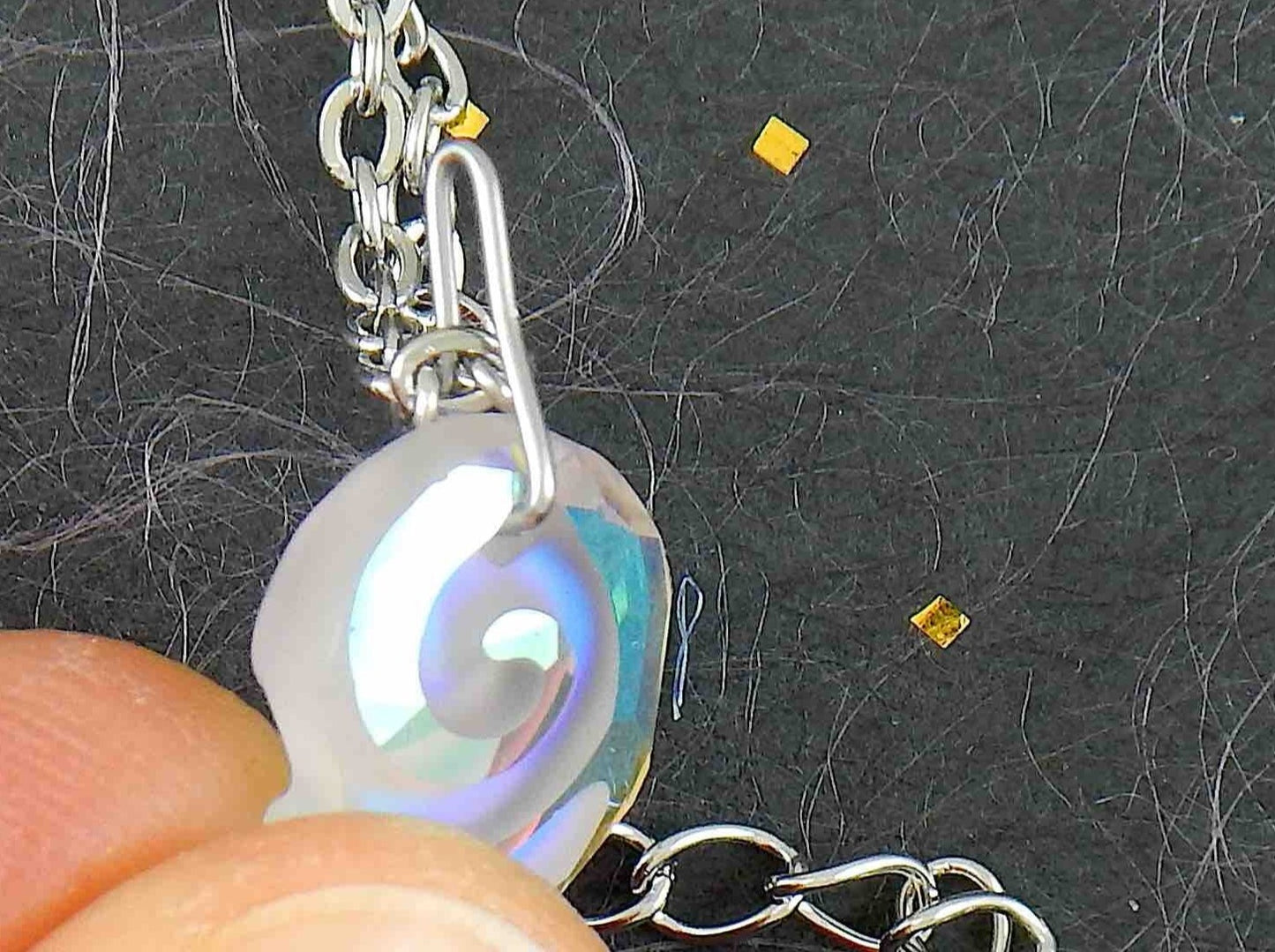 15-inch necklace with 15mm iridescent clear swirl shell Swarovski crystal pendant, stainless steel chain