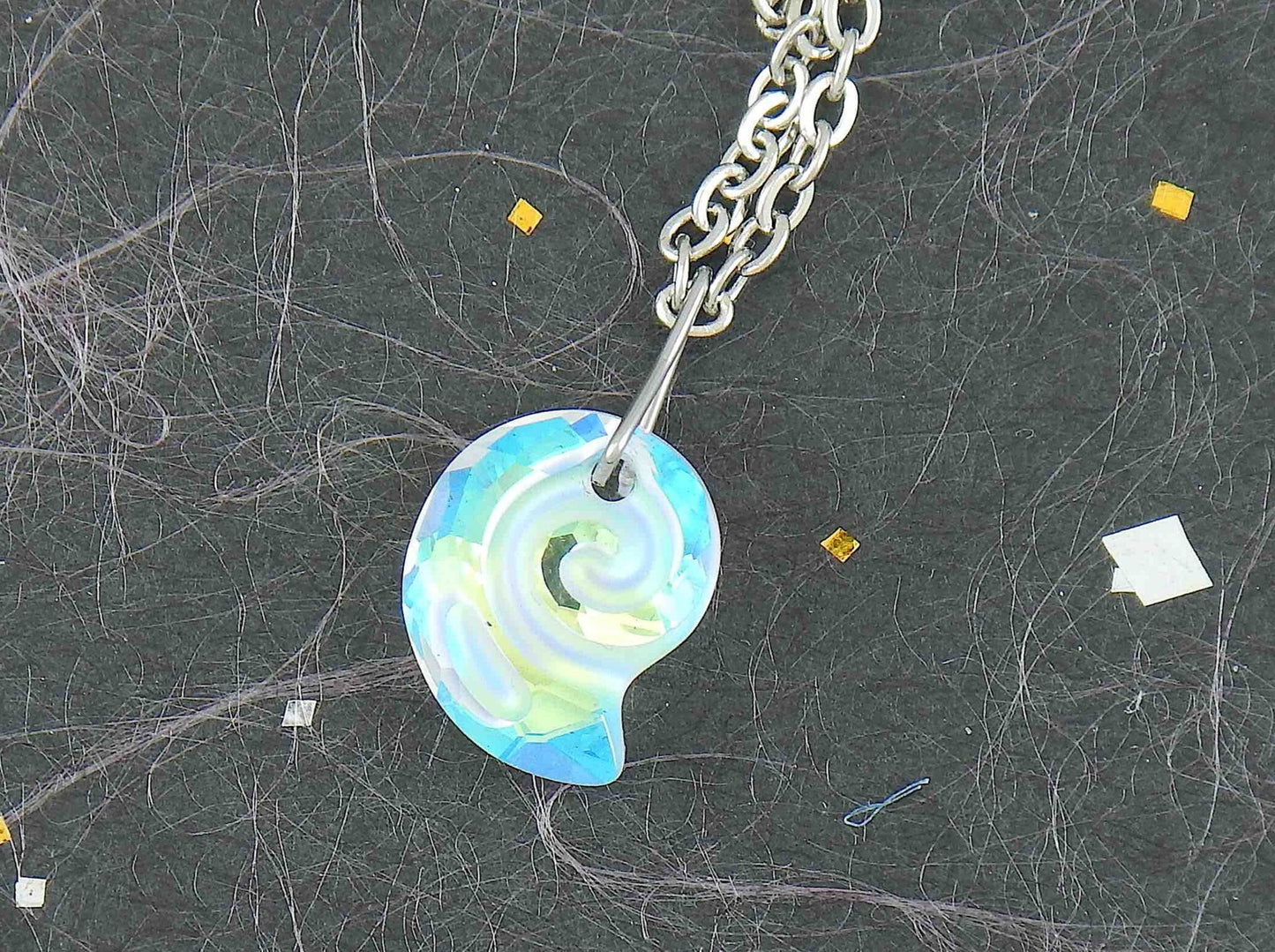 15-inch necklace with 15mm iridescent clear swirl shell Swarovski crystal pendant, stainless steel chain