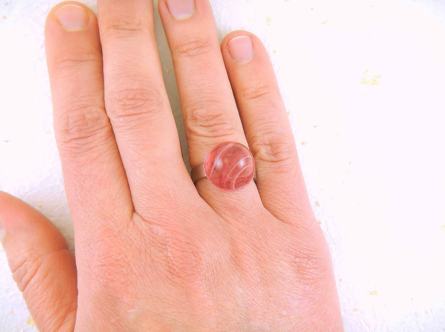 Finger ring with large marbled pink vintage glass dome, adjustable stainless steel base