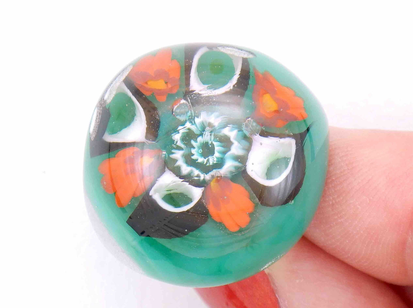 Finger ring with large round emerald green cabochon (Murano style glass handmade in Montreal), orange-white-black flowers, stainless steel adjustable base (US 7-8)