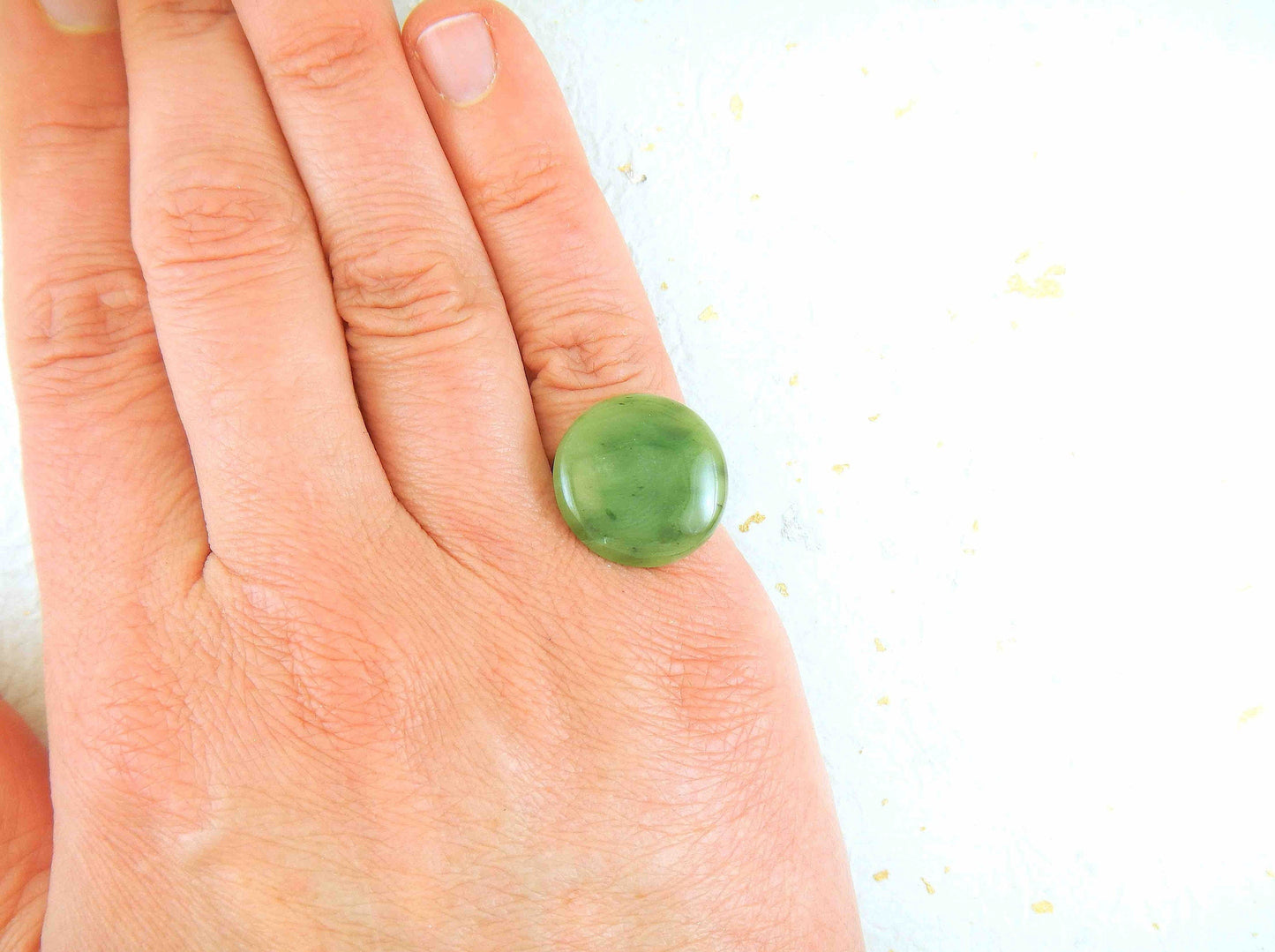 Finger ring with round dark green nephrite jade stone cabochon, stainless steel adjustable base
