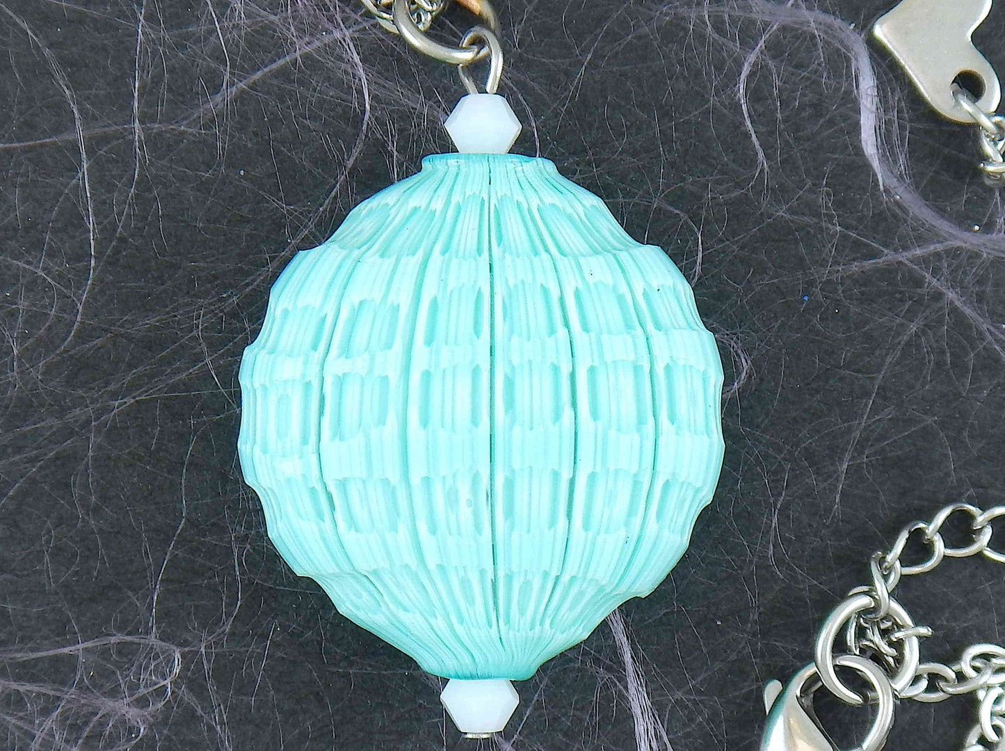 20-inch necklace with turquoise faceted Murano blown glass round pendant, Opal white Swarovski crystals, stainless steel chain
