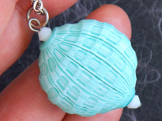 20-inch necklace with turquoise faceted Murano blown glass round pendant, Opal white Swarovski crystals, stainless steel chain