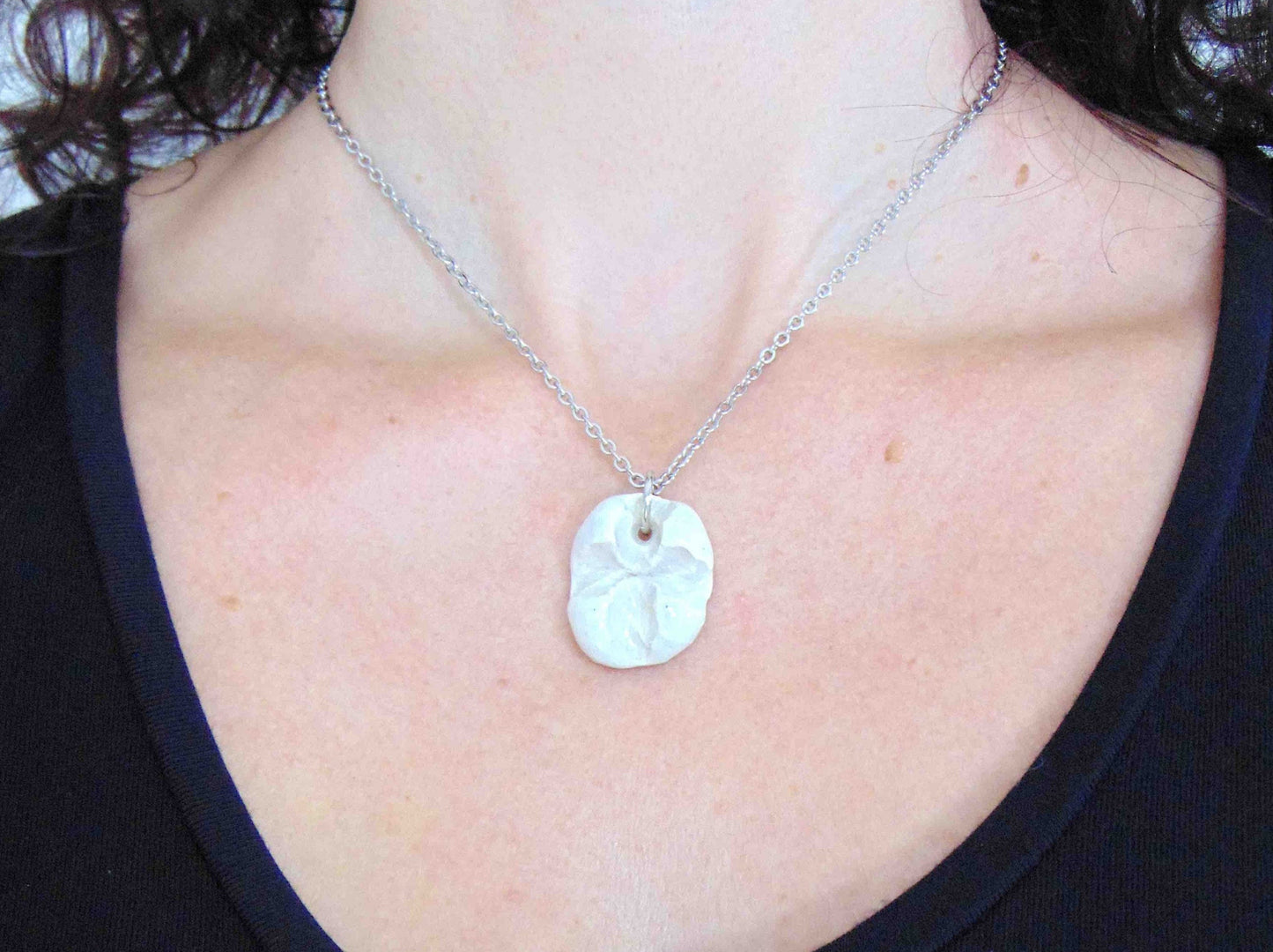 16-inch necklace with white ceramic knot pendant handmade in Montreal, stainless steel chain