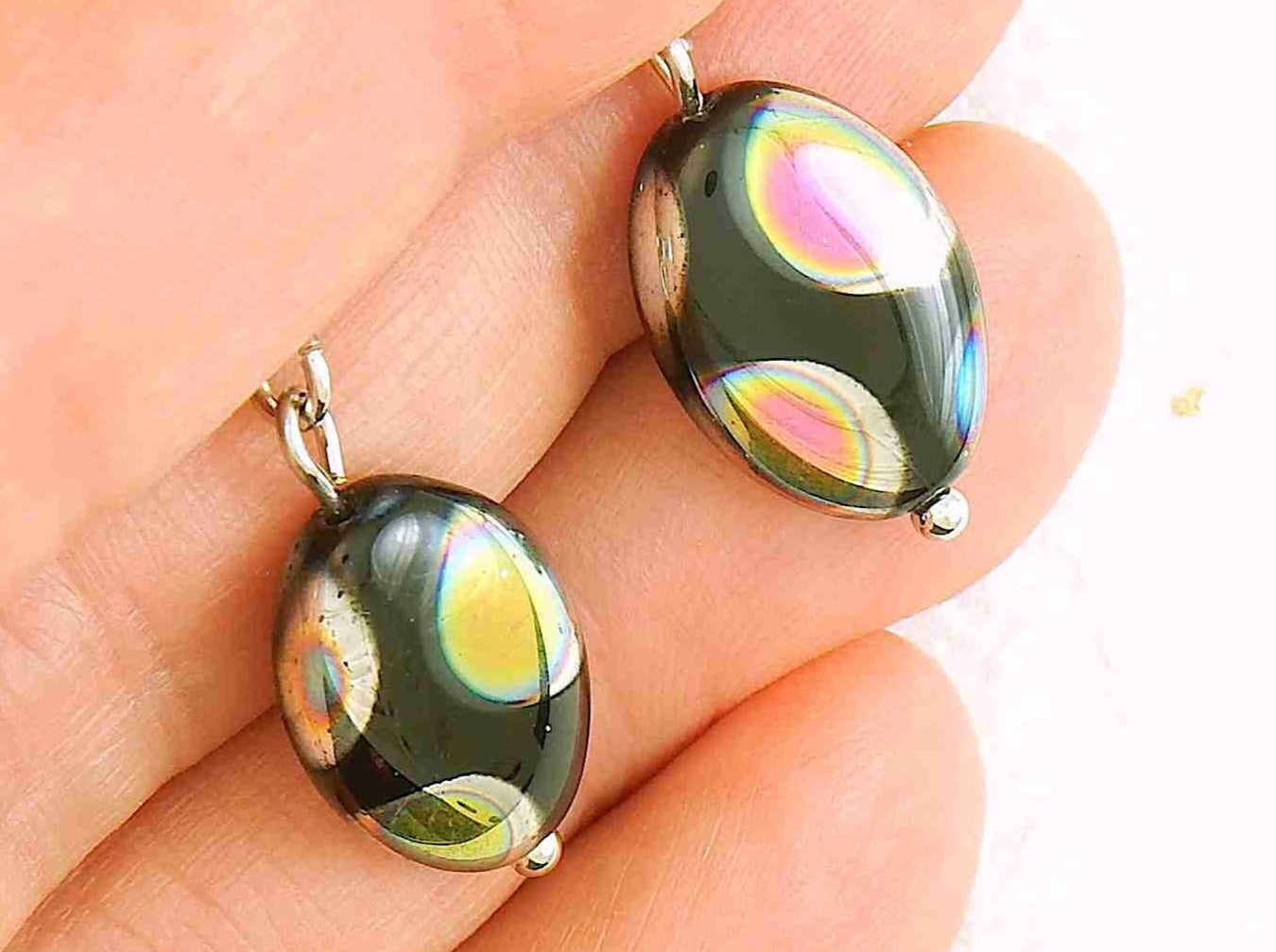 Short earrings with shiny black Czech glass ovals, choice of 2 patterns (multicoloured dots, silver criss-cross), stainless steel lever back hooks
