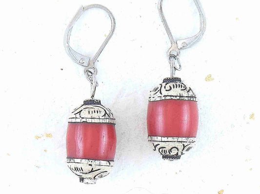 Short earrings with red resin and pewter Tibetan cylinders, sculpted caps, stainless steel lever back hooks