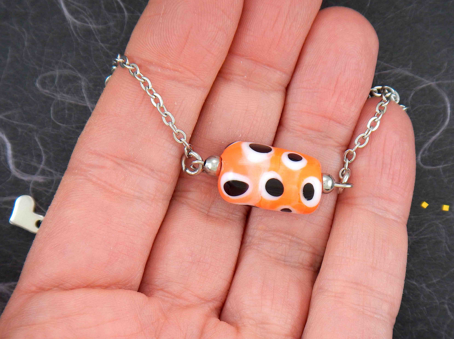 14-inch necklace with bright orange glass cylinder, black and white dots (Murano-style glass handmade in Montreal), stainless steel chain