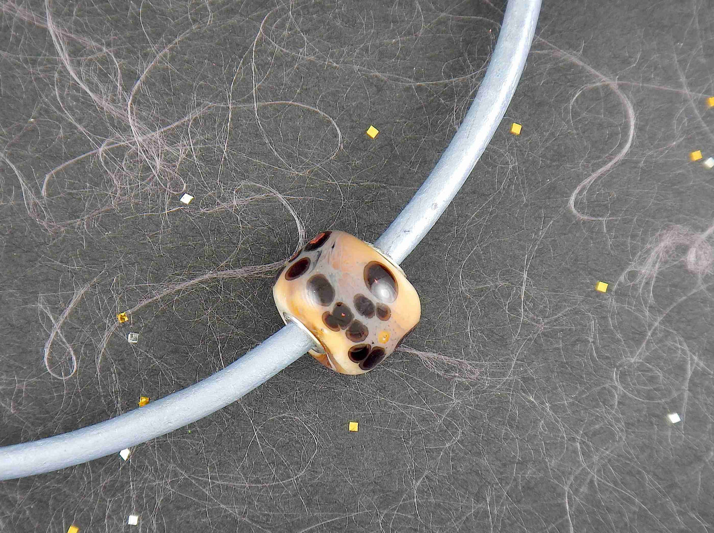 Choker necklace with off-white cylinder glass bead (Murano-style glass handmade in Montreal), black and orange dots, baby blue leather cord, stainless steel clasp