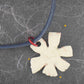 16-inch necklace with blue-red-yellow ceramic daisy flower pendant handmade in Montreal, dark blue cork cord, aluminum ring, stainless steel clasp