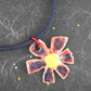 16-inch necklace with blue-red-yellow ceramic daisy flower pendant handmade in Montreal, dark blue cork cord, aluminum ring, stainless steel clasp