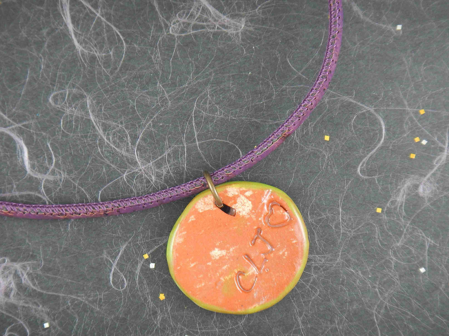18-inch necklace with white-green-violet terracotta ceramic medallion pendant handmade in Montreal, flower pattern, violet cork cord, aluminum ring, stainless steel clasp