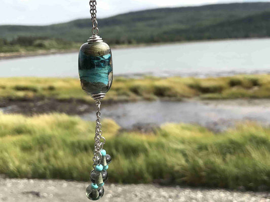 28-inch necklace with funky cylinder, dark turquoise-gray marbled pattern (Murano-style glass handmade in Montreal), matching pendants, stainless steel chain