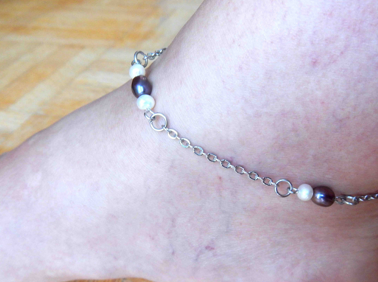 Anklet with iridescent violet and white natural freshwater pearls on stainless steel chain