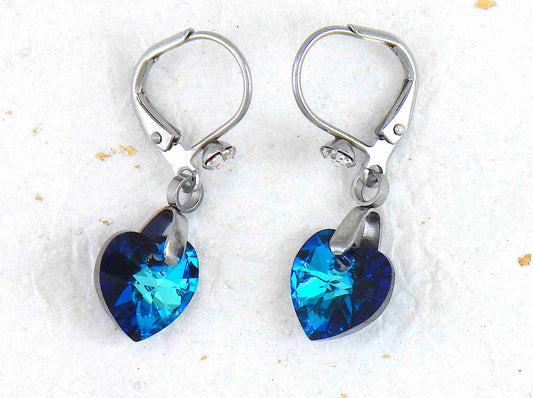 Short earrings with 10mm faceted Bermuda Blue Swarovski crystal hearts, stainless steel lever back hooks with tiny clear crystals