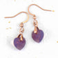 Short earrings with 10mm faceted Lilac Shadow Swarovski crystal hearts, rose-gold toned stainless steel hooks