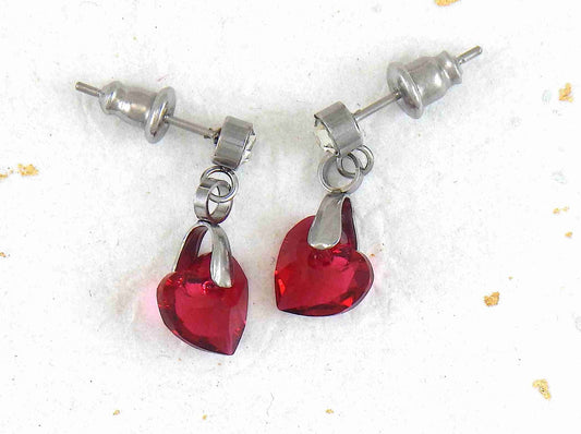 Short earrings with 8mm Scarlet (deep red) faceted Swarovski crystal hearts, stainless steel studs with tiny crystals