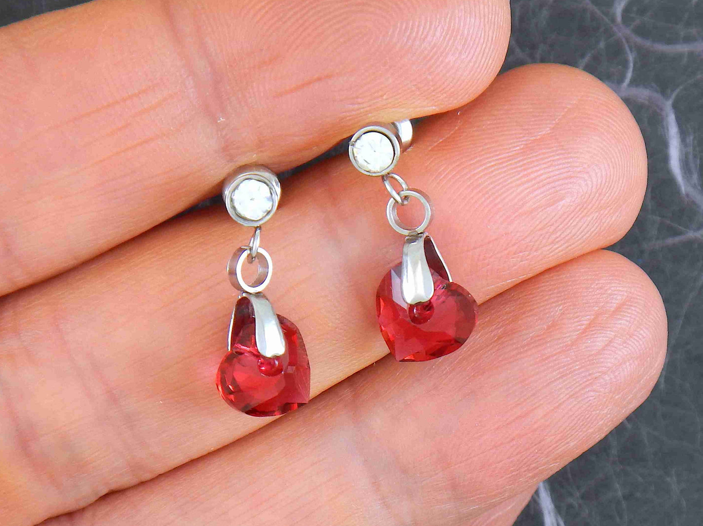 Short earrings with 8mm Scarlet (deep red) faceted Swarovski crystal hearts, stainless steel studs with tiny crystals