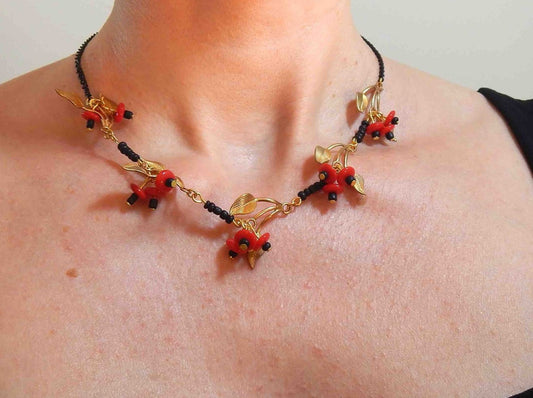 16-inch necklace with gold-toned metal leaves and red glass berries, aluminum chain