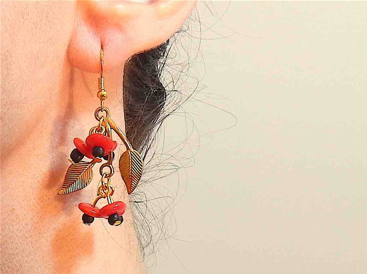 Long earrings with golden leaves and red glass fruits, metal hooks