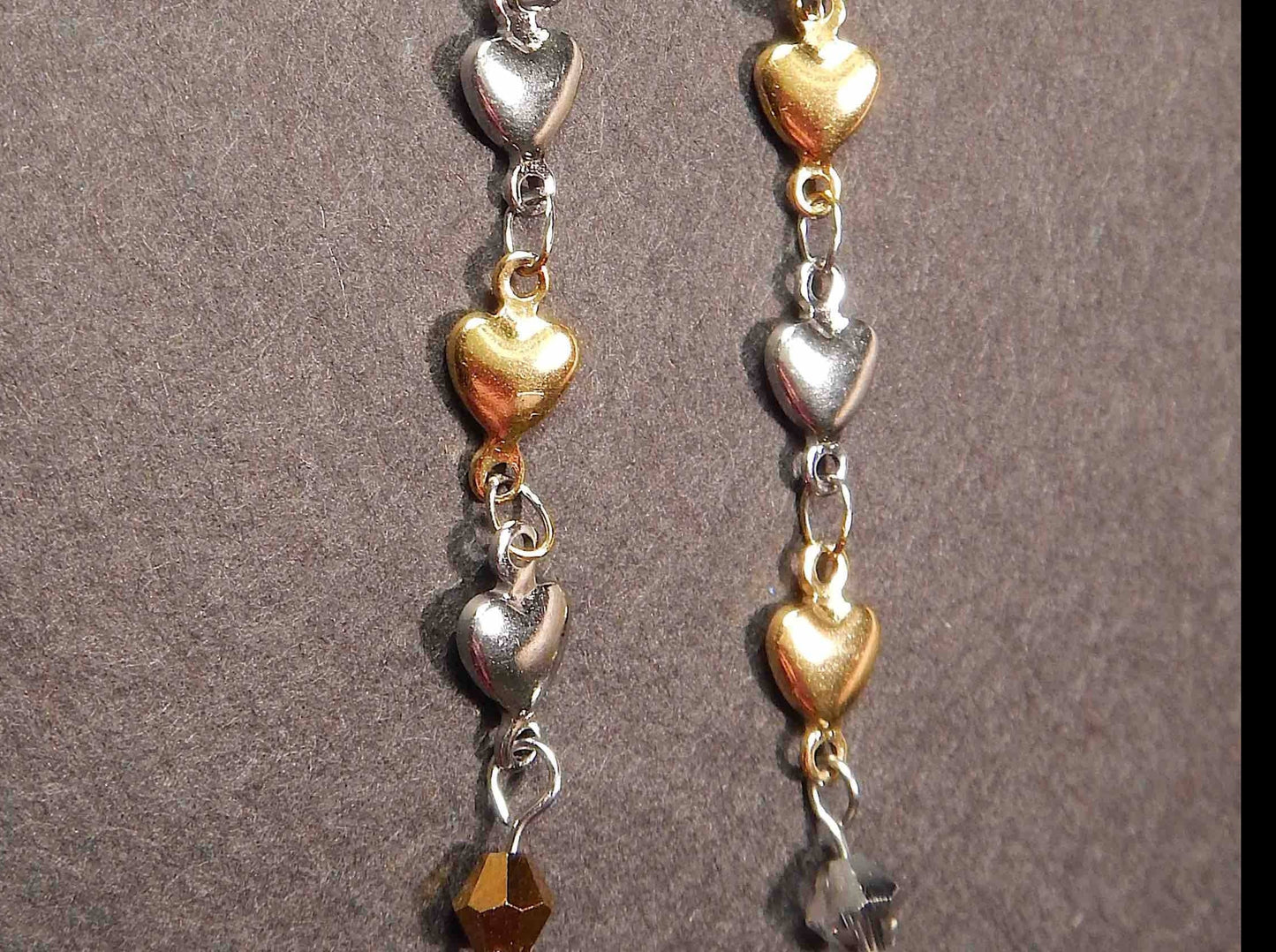 Long earrings with delicate alternating silver and gold heart chain, stainless steel lever back hooks