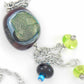 27-inch necklace with funky glass bead and matching pendants in dark red-lime green-black (Murano-style glass handmade in Montreal), stainless steel chain