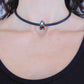 Choker necklace with black glass bead (Murano-style glass handmade in Montreal), 3-dimensional flowers in red-green-white, black leather cord, stainless steel clasp