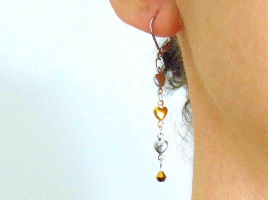 Long earrings with delicate alternating silver and gold heart chain, stainless steel lever back hooks