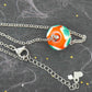 14-inch necklace with burnt orange ball, large white & green dots (Murano-style glass handmade in Montreal), stainless steel chain