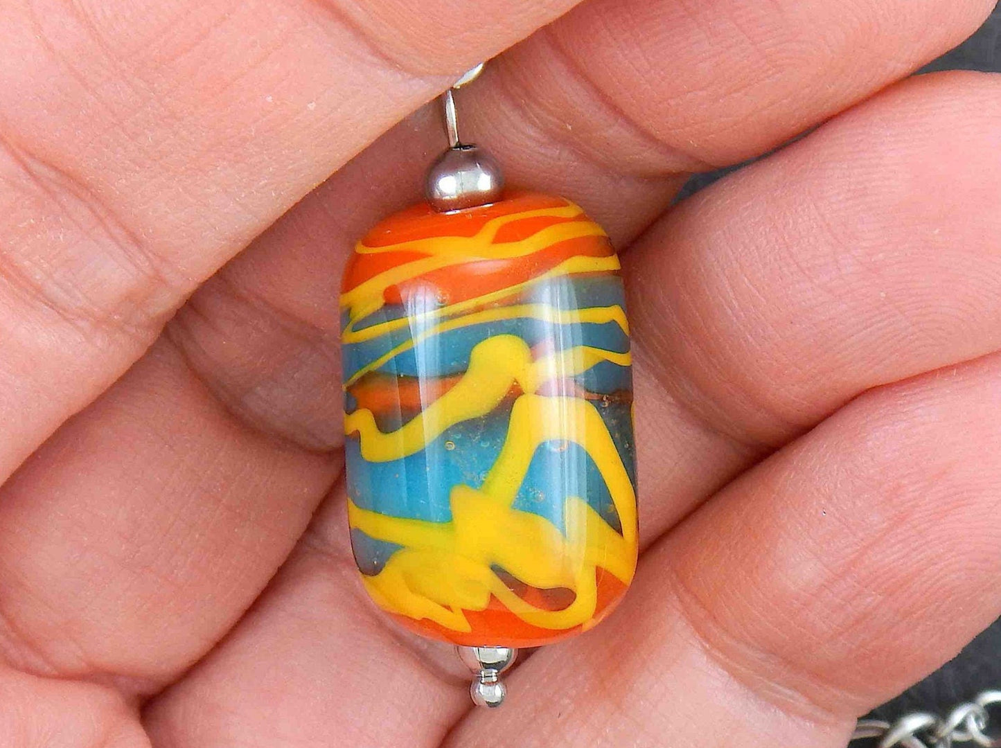 14-inch necklace with burnt orange glass cylinder marbled in turquoise & yellow (Murano-style glass handmade in Montreal), stainless steel chain