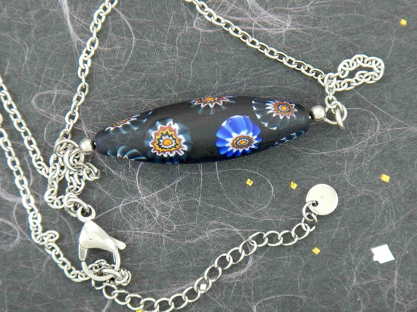 14-inch necklace with matte black Murano glass pointed cylinder, blue and brown murines patterns, stainless steel chain