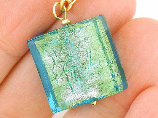 16-inch necklace with bright turquoise Murano glass on gold foil square, rectangle-link gold-toned stainless steel chain