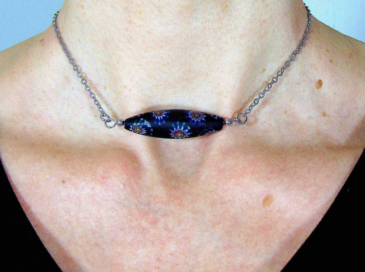 14-inch necklace with matte black Murano glass pointed cylinder, blue and brown murines patterns, stainless steel chain