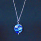 29-inch necklace with Murano glass round pendant marbled in dark blue, turquoise, black and white, stainless steel chain