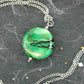 29-inch necklace with Murano glass round pendant marbled in bright apple green, black and white, stainless steel chain