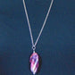 29-inch necklace with twisted Murano glass cylinder marbled in pink, black and white, stainless steel chain