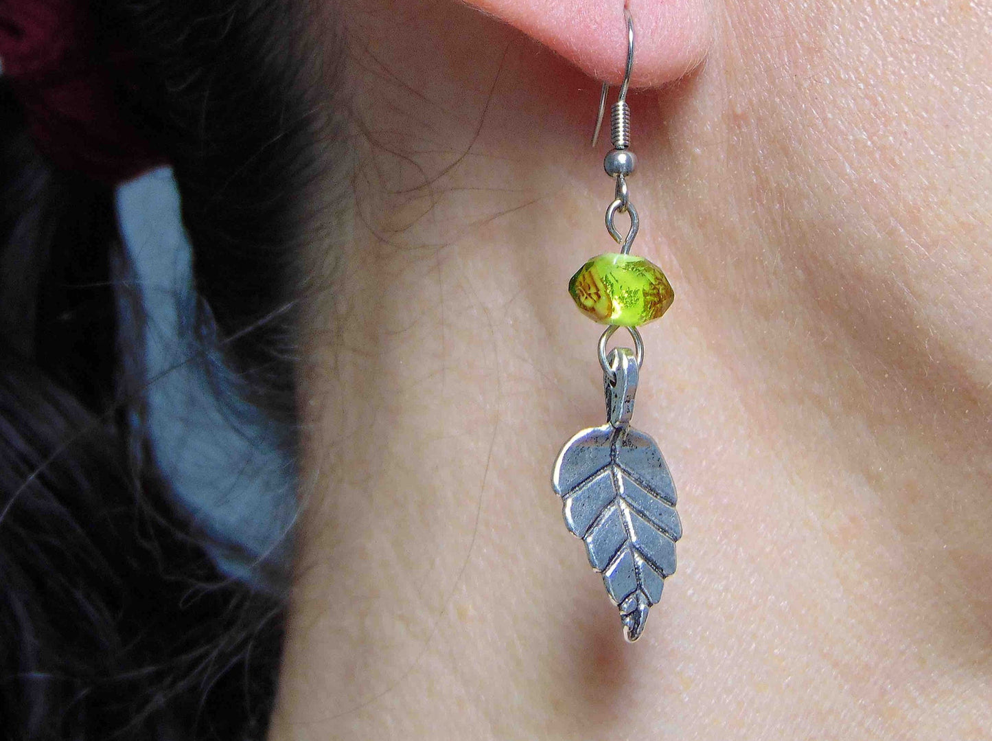 Long earrings with pewter leaves and lime green faceted crystal balls, tiny rose detail, stainless steel hooks