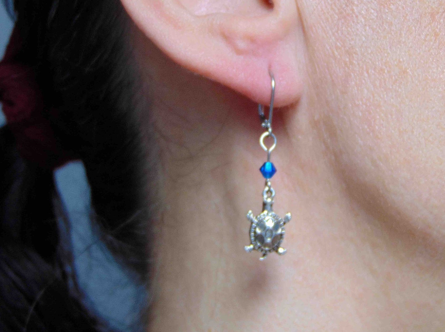 Long earrings with small silver turtles and metallic blue Swarovski crystals, stainless steel lever back hooks