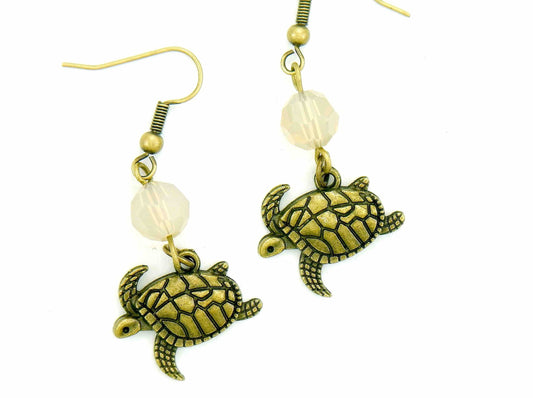 Long earrings with brass swimming turtles and Sand Opal Swarovski crystal balls, brass hooks