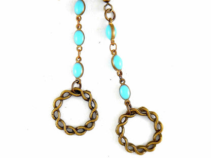Boucles d'oreilles longues anneaux laiton torsadés et chaîne d'oeufs colorés (blanc crème, noir ou turquoise), crochets laiton