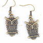 Short earrings with large brass owls sitting on a branch, brass hooks