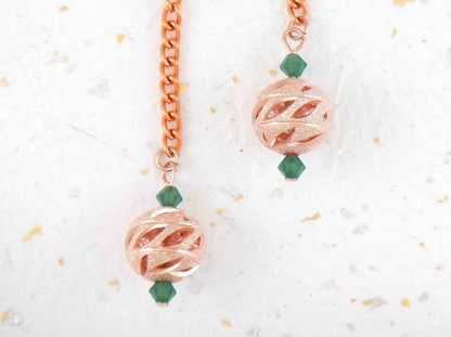 Long earrings with rose gold filigree balls and Swarovski crystals, rose-gold plated metal lever back hooks