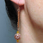 Long earrings with rose gold filigree balls and Swarovski crystals, rose-gold plated metal lever back hooks
