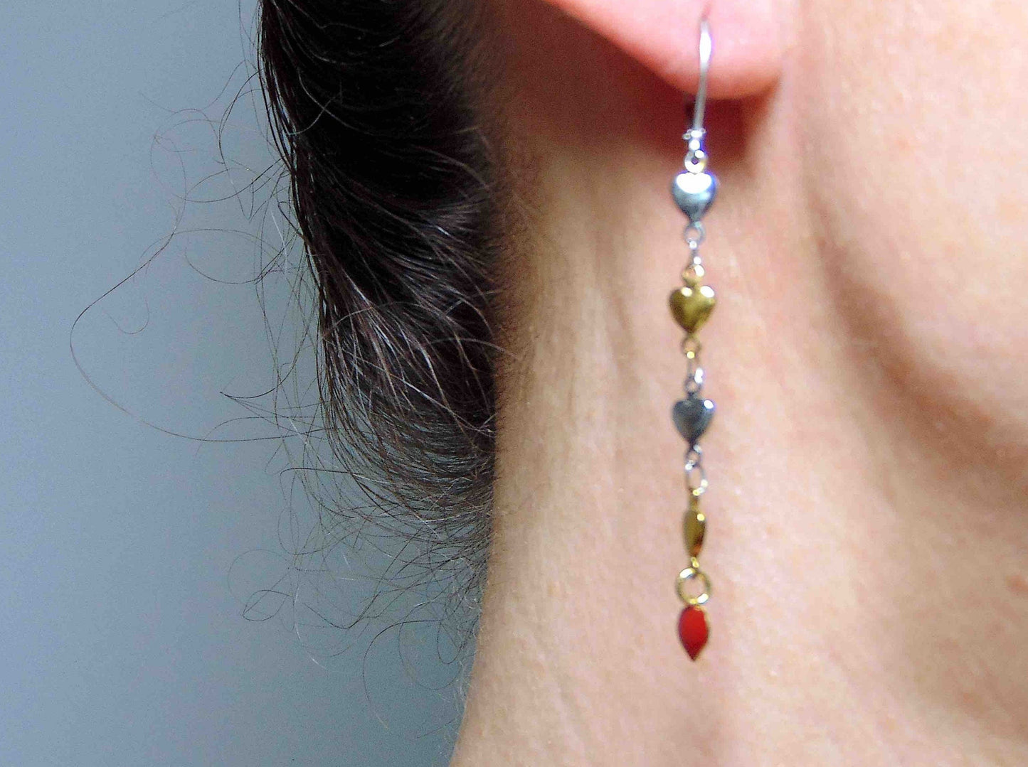 Long earrings with delicate alternating silver and gold heart chain, red enamelled heart, stainless steel lever back hooks