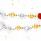 Long earrings with delicate alternating silver and gold heart chain, red enamelled heart, stainless steel lever back hooks
