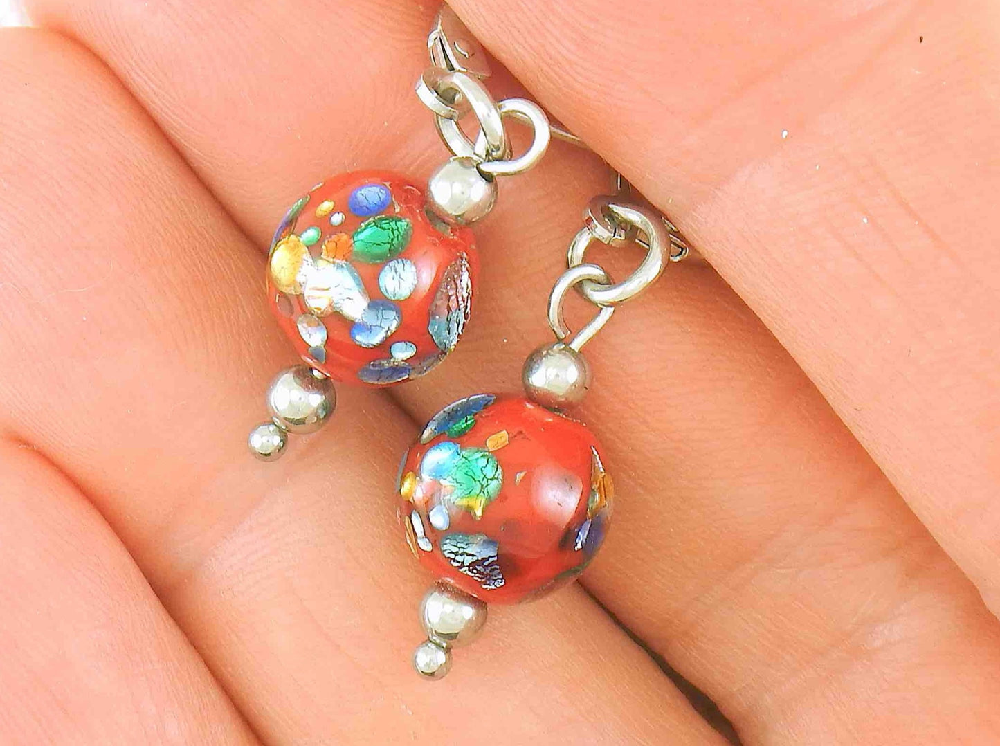 Short earrings with bright red vintage glass balls, metallic silver-yellow-green-blue inclusions, stainless steel lever back hooks