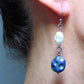 Long earrings with matte indigo blue and iridescent white vintage glass craters beads, stainless steel hooks
