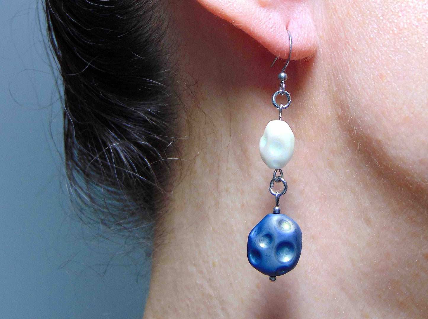 Long earrings with matte indigo blue and iridescent white vintage glass craters beads, stainless steel hooks